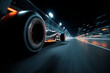 © Enrique - Formula 1 racing car speeds along the night road in the dark in motion with a close view of the rear wheel, with space for text