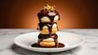 Decadent dessert featuring three stacked pastries topped with rich chocolate glaze and gold flakes, served on white plate