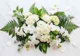 Elegant white and green floral arrangement with hydrangeas and orchids