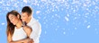 © BillionPhotos.com - Portrait of happy young couple at festive background