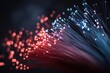 © sirikarn - Macro photography of glowing fiber optic cables carrying data. Abstract technology background.