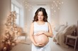 © BillionPhotos.com - Beautiful pregnant woman holds her belly