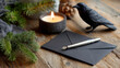 ©  VladaToday - A black envelope with a silver fountain pen beside a candle and raven on a rustic wooden surface for unique holiday correspondence
