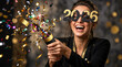 © PhotoGranary - Happy woman wearing 2026 party glasses celebrating New Year with a confetti popper. Cheerful party scene with colorful confetti explosion and golden bokeh background.