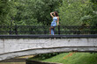 © Andrey_Arkusha - Young beautiful brunette woman in blue knitted dress posing in summer park