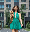 © Andrey_Arkusha - Lady with puppy dog. Young beautiful woman walks with her poodle dog