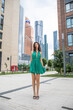 © Andrey_Arkusha - Young beautiful brunette woman in a green polka dot dress