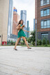 © Andrey_Arkusha - Young beautiful brunette woman in a green polka dot dress