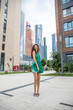 © Andrey_Arkusha - Young beautiful brunette woman in a green polka dot dress