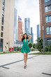 © Andrey_Arkusha - Young beautiful brunette woman in a green polka dot dress