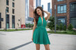 © Andrey_Arkusha - Young beautiful brunette woman in a green polka dot dress