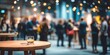 © Hunaningshasih - Blurred event with people, drinks, and festive lighting.