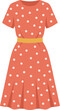 © Wahyu - Cute orange polka dot summer dress with a yellow belt.
