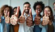 © Viktor - Diverse team gives thumbs up sign. People show agreement and success. They look happy and support each other. This shows unity and good spirit.