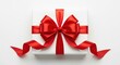 © siam - Top view of a white square gift box wrapped with a vibrant red satin ribbon and a large, perfectly tied bow, isolated on white background