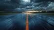 © sunny - Empty wet runway with glowing centerline stretching to distant horizon under heavy storm clouds and a burst of sunset light, dramatic moody tension and solitude