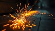 © Alice - welding. Close-up of glowing orange sparks on textured metal in a dark industrial environment. safety posters, maintenance manuals, designed for precision metalworking and fabrication facilities.
