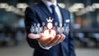 © Media Srock - Business executive presents illuminated leader icon with team silhouettes floating above open palm