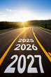 © MST Sabikunnahar - Road ahead with 2025 2026 2027 painted on asphalt towards sunset