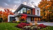 © ha - Modern two-story residence with vibrant fall foliage backdrop
