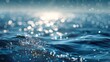 © touseef - Bright water surface with soft blue bokeh and glittering light reflections creating a serene sparkling background for fresh clean aqua themes, calming nature designs, and elegant abstract visuals