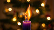 © Mim Islam - Close up of a vibrant purple advent candle with a bright orange flame flickering against a softly blurred background of warm golden bokeh lights from a christmas tree First Sunday of Advent