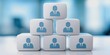 © Kedsara - Concept of Corporate Stability Governance. A stack of six blocks displays blue icons representing professional figures, symbolizing teamwork and collaboration in a business environment.