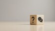© Husen - Wooden block with a question mark and speech bubble icons symbolizing questions, answers, and communication.
