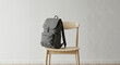 © Tamaras Pictures 4U - Stylish gray backpack resting on wooden chair in minimalist interior