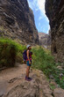 © Xalanx - Hiker in dramatic narrow canyon