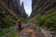 © Xalanx - Hiker in dramatic narrow canyon