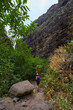 © Xalanx - Hiker in dramatic narrow canyon