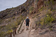© Xalanx - Hiker ascending canyon trail Tenerife