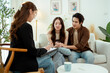 © tonefotografia - Couple in Counseling Session Discussing Relationship Issues With Therapist in Bright Office