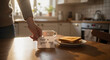 © Angavlan - Person leaves handwritten message that reads have a great day with coffee and toast, sweet note on kitchen table. Have a great day wish is a thoughtful gesture to brighten someone’s morning.