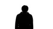 © acoustIcara - Silhouette of an anonymous person wearing a casual dark hoodie standing against a bright white background, creating mystery and high contrast.