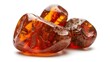 © kaowsar - Three natural amber stones, ancient fossilized resin gemstone