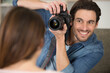 © auremar - bearded stylish photographer taking a photo of his wife