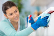© auremar - woman cleaning kitchen at home