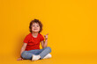 © New Africa - Portrait of cute little boy on orange background, space for text