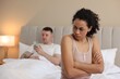 © New Africa - Offended couple after quarrel ignoring each other in bed at home, selective focus