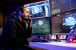 © DC Studio - Hacker installing spyware with artificial intelligence to secretly gather data about user activity. Rogue engineer coding exploits using machine learning to gain unauthorized access