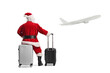 © Ljupco Smokovski - Rear view shot of Santa Claus sitting on a suitcase and looking at a plane