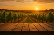 © Vladyslav Tykhonov - Picturesque vineyard with a wooden table in the foreground. The sun is setting, casting a warm glow over the rows of grapevines. The scene is tranquil and inviting