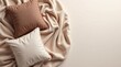 © jockermax3d - Soft throw pillows in neutral tones resting on a cozy beige blanket with copy space, perfect for home decor and comfort themes