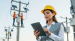 © ABAStock - Female electrical engineer uses a tablet to inspect smart grid infrastructure outdoors