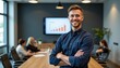 © ColorfulFlowerStudio - Confident young man standing in a modern conference room with team members engaged in a business meeting and presentation visuals behind