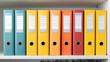 © Smart AI - Colorful office ring binders neatly organized on shelf