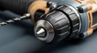 © Ilham - Detailed closeup of electric drill showcasing the chuck and drill bit