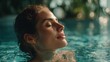 © mila103 - A woman with closed eyes finds peace while floating in a calm swimming pool. Sunlight filters through leaves creating a tranquil atmosphere. The scene radiates relaxation and serenity.